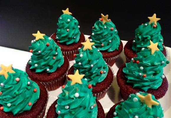 Chocolate cupcakes with green Christmas tree icing on top