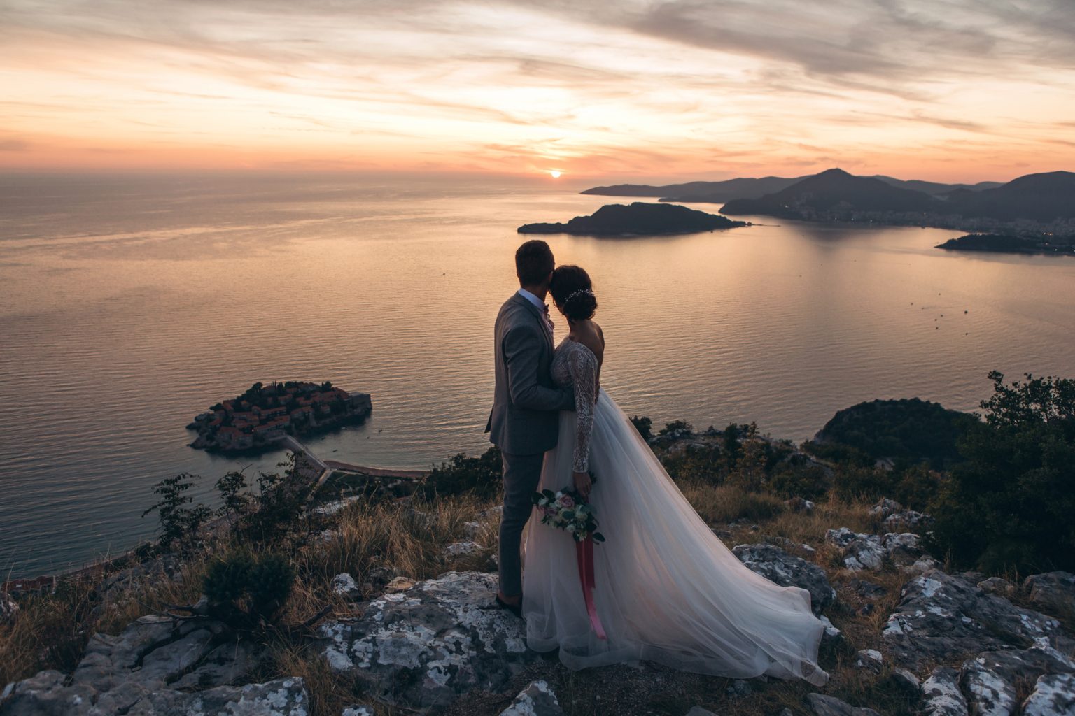 bride and groom admire the landscape